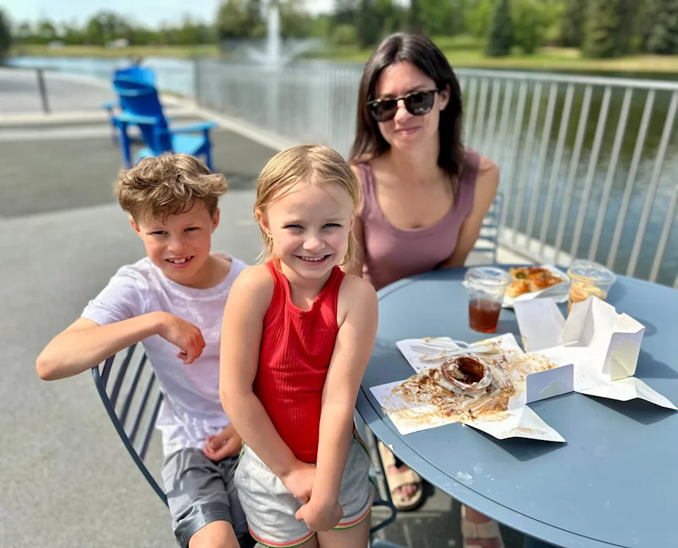 Liz Yachimec and her children, Jaxson Palumbi, 8, and Ayla Palumbi, 6, sit outside the new restaurant Lift Me Up on the Lake by Tiramisu Bistro in Hawrelak Park.