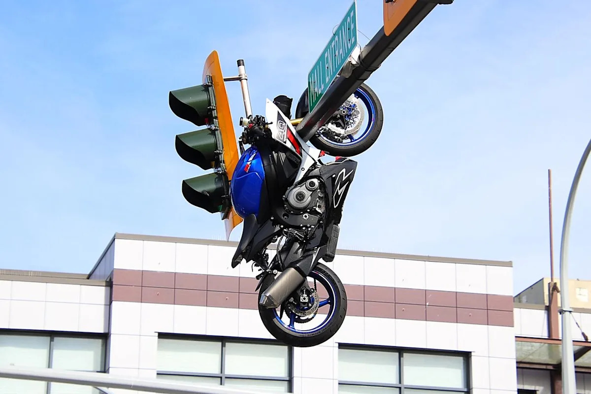 Motorcyclist seriously injured after crash leaves bike dangling from traffic light near Surrey-Delta border