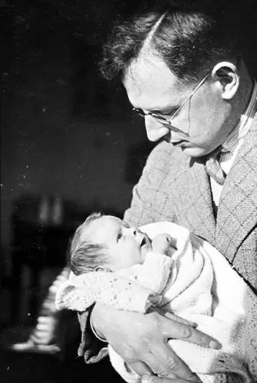 Stephen Hawking's father Frank holding baby Stephen.