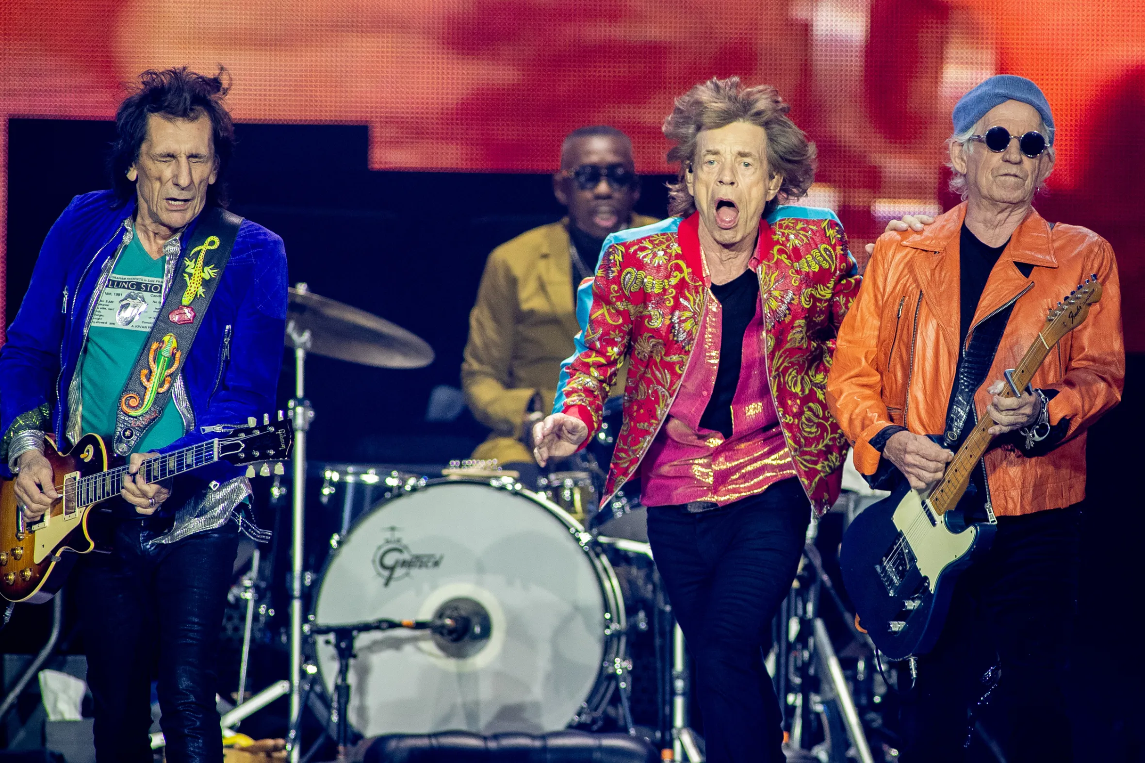 Mick Jagger, Ron Wood, and Keith Richards of The Rolling Stones perform on stage.