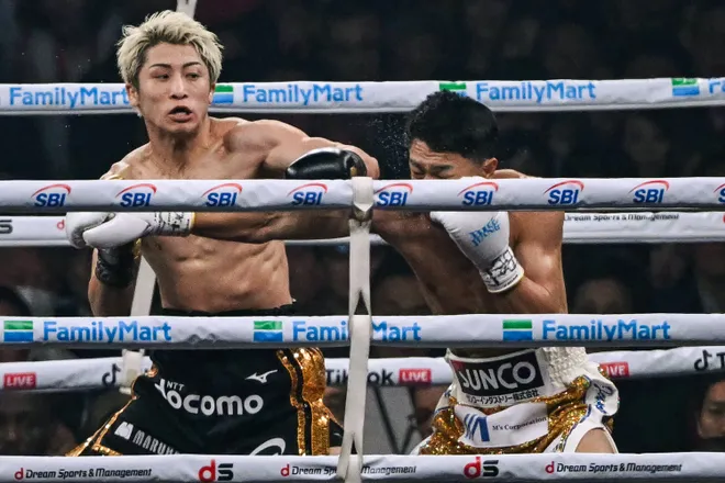 Naoya Inoue (L) fights Junto Nakatani during their super bantamweight championship boxing contest at Tokyo Dome in Tokyo on May 2, 2026. (Photo by Yuichi YAMAZAKI / AFP via Getty Images)