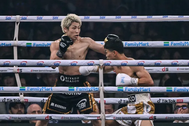 Naoya Inoue (L) fights Junto Nakatani during their super bantamweight championship boxing contest at Tokyo Dome in Tokyo on May 2, 2026. (Photo by Yuichi YAMAZAKI / AFP via Getty Images)