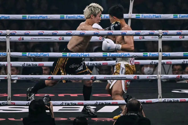Naoya Inoue (L) fights Junto Nakatani during their super bantamweight championship boxing contest at Tokyo Dome in Tokyo on May 2, 2026. (Photo by Yuichi YAMAZAKI / AFP via Getty Images)