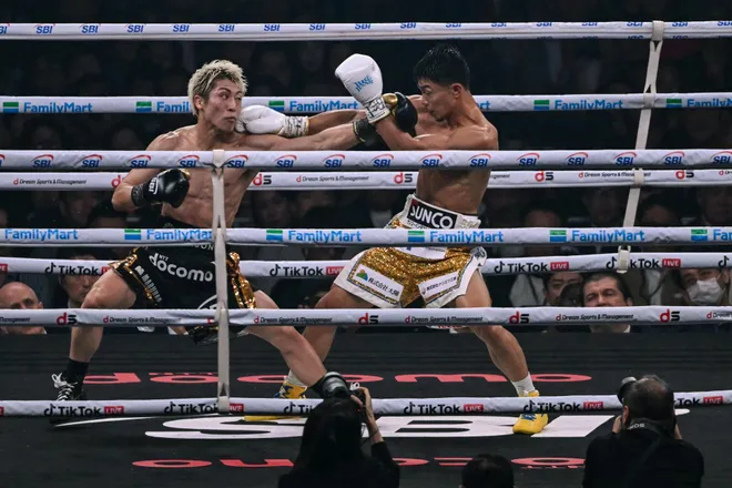 Naoya Inoue (L) fights Junto Nakatani during their super bantamweight championship boxing contest at Tokyo Dome in Tokyo on May 2, 2026. (Photo by Yuichi YAMAZAKI / AFP via Getty Images)