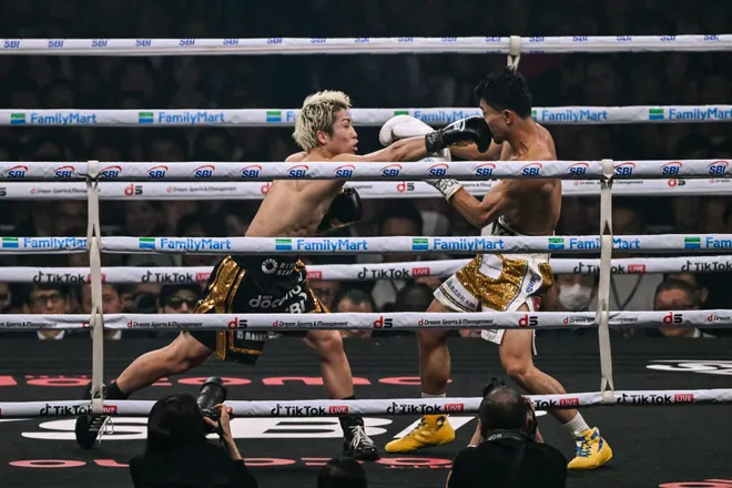 Naoya Inoue (L) fights Junto Nakatani during their super bantamweight championship boxing contest at Tokyo Dome in Tokyo on May 2, 2026. (Photo by Yuichi YAMAZAKI / AFP via Getty Images)