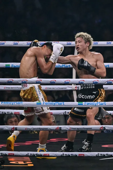 Naoya Inoue (R) fights Junto Nakatani during their super bantamweight championship boxing contest at Tokyo Dome in Tokyo on May 2, 2026. (Photo by Yuichi YAMAZAKI / AFP via Getty Images)