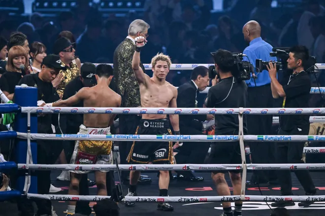 Naoya Inoue (C) reacts after defeating Junto Nakatani in their super bantamweight championship boxing contest at Tokyo Dome in Tokyo on May 2, 2026. (Photo by Yuichi YAMAZAKI / AFP via Getty Images)