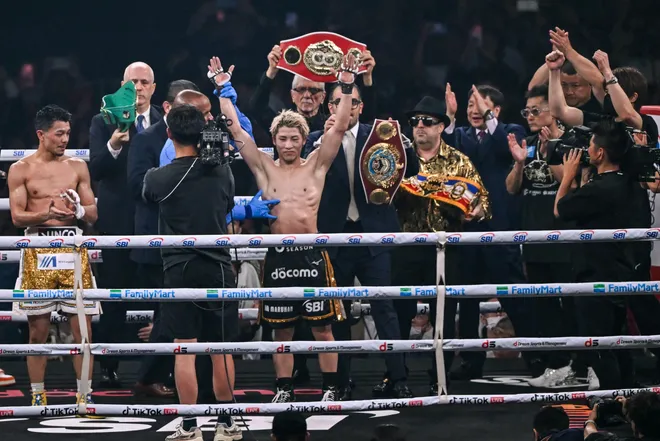 Naoya Inoue (C) celebrates defeating Junto Nakatani in their super bantamweight championship boxing contest at Tokyo Dome in Tokyo on May 2, 2026. (Photo by Yuichi YAMAZAKI / AFP via Getty Images)