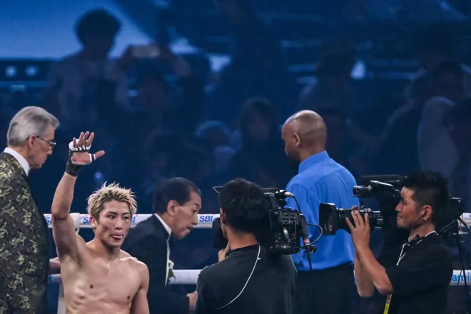 Naoya Inoue (L) celebrates defeating Junto Nakatani in their super bantamweight championship boxing contest at Tokyo Dome in Tokyo on May 2, 2026. (Photo by Yuichi YAMAZAKI / AFP via Getty Images)