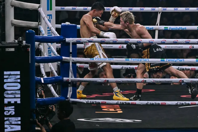 Naoya Inoue (R) fights Junto Nakatani during their super bantamweight championship boxing contest at Tokyo Dome in Tokyo on May 2, 2026. (Photo by Yuichi YAMAZAKI / AFP via Getty Images)