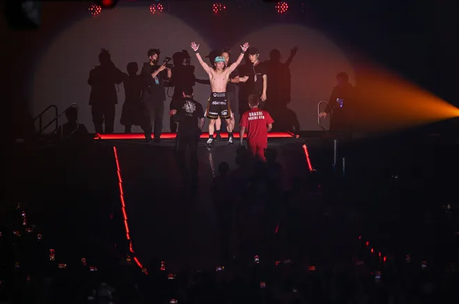Naoya Inoue (C) poses as he leaves the stadium after defeating Junto Nakatani during their Super bantamweight championship contest at Tokyo Dome in Tokyo on May 2, 2026. (Photo by Yuichi YAMAZAKI / AFP via Getty Images)