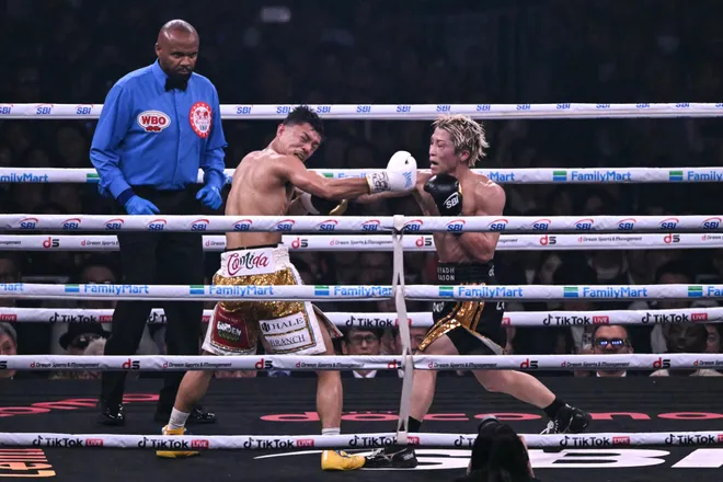 Naoya Inoue (R) fights Junto Nakatani during their Super bantamweight championship contest at Tokyo Dome in Tokyo on May 2, 2026. (Photo by Yuichi YAMAZAKI / AFP via Getty Images)