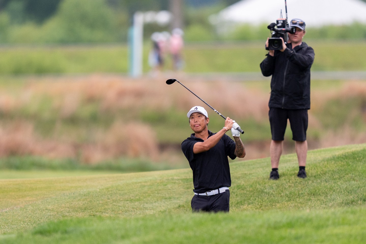 Anthony Kim hits from a bunker during the team championship after the final round of LIV Golf Virginia golf tournament at Trump National Golf Club on May 10. [REUTERS/YONHAP]