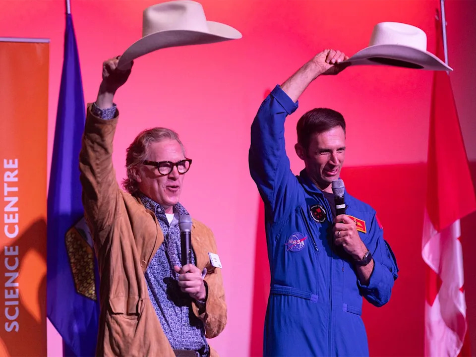 Alberta-born astronaut Col. Joshua Kutryk was presented a white cowboy hat in a ceremony by Tourism Calgary’s Fraser Abbott at Telus Spark in Calgary on Sunday, May 24, 2026.