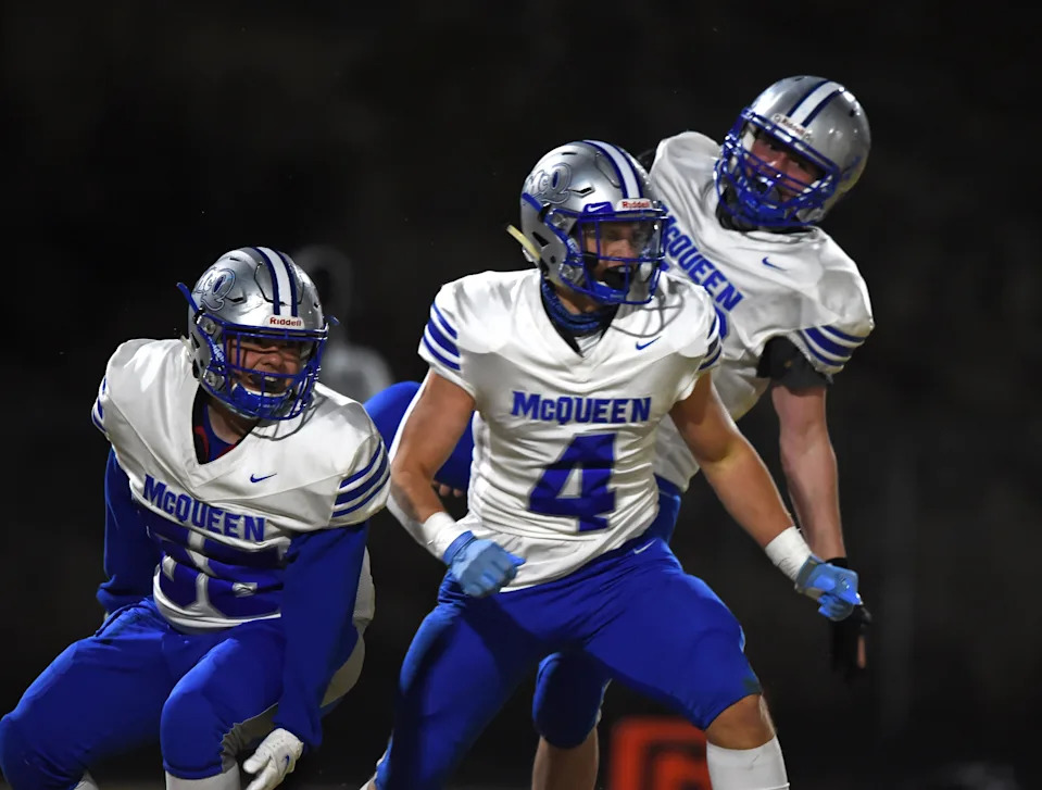 McQueen's #4 Robby Snelling celebrate a touchdown with teammate during Friday's game against Spanish Springs at Spanish Springs on March 12, 2021. McQueen whenn on to win 26-20.