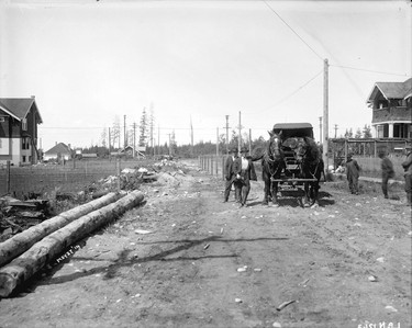 1914: Men with horse-drawn carriage on 2100 block of 48th Avenue, looking west towards West Boulevard.