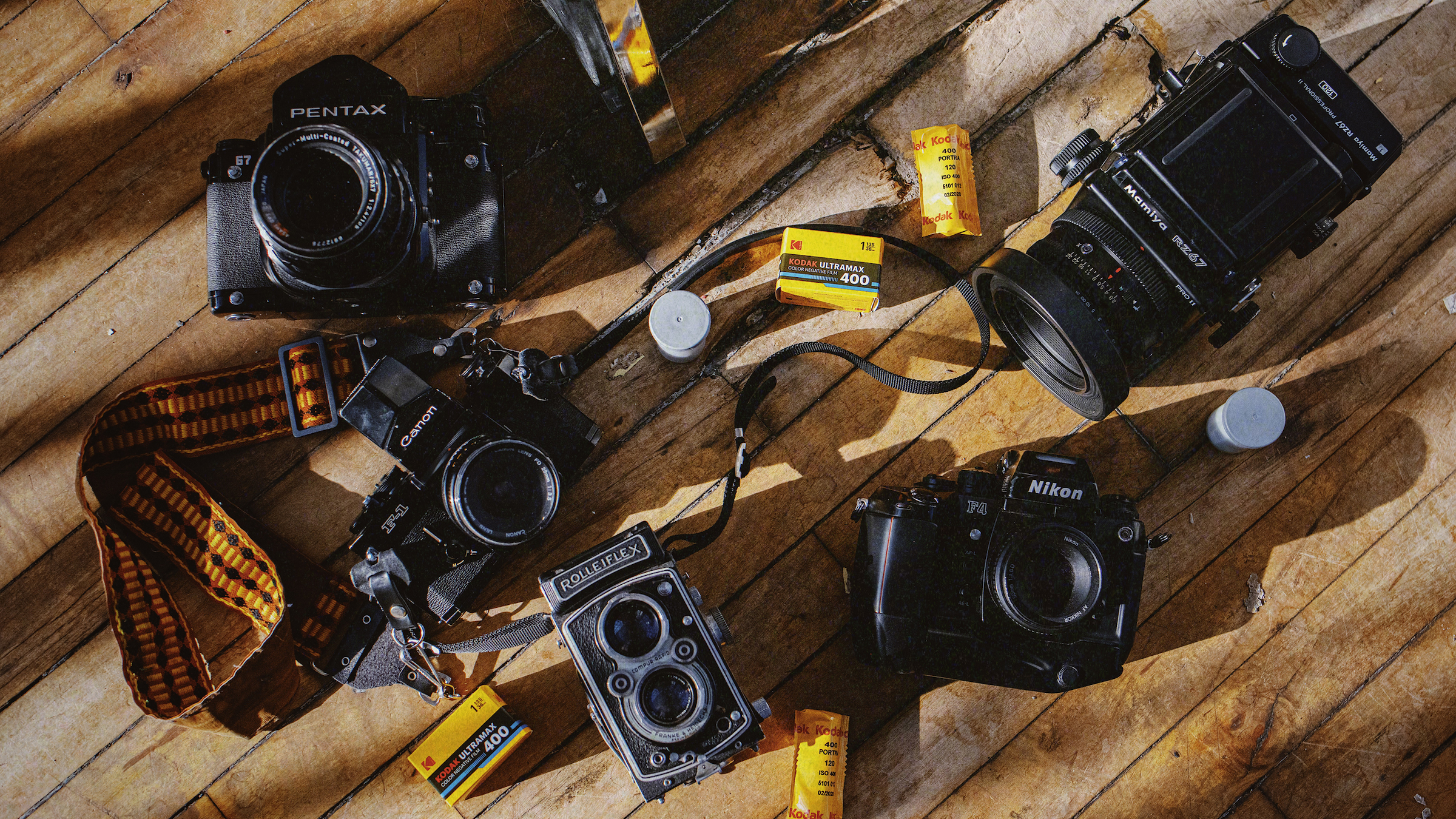 Photographers use a variety of cameras on a VSCO anti-AI campaign
