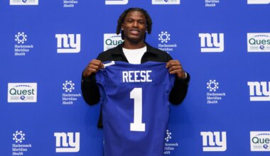 Ohio State football first round NFL draft picks pose in new uniforms