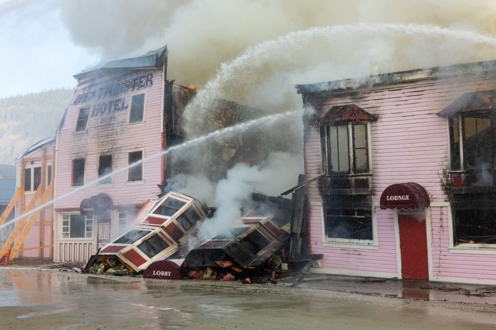 Firefighters work to extinguish a structure fire at the Westminster Hotel, a historic building from the gold-rush era, in Dawson City, Yukon, in a Sunday, May 17, 2026, handout photo. THE CANADIAN PRESS/Handout — Manu Keggenhoff (Mandatory Credit)