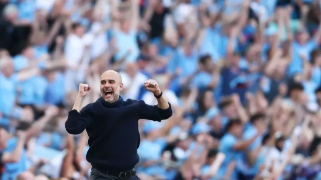 Pep Guardiola, Manager of Manchester City, celebrates