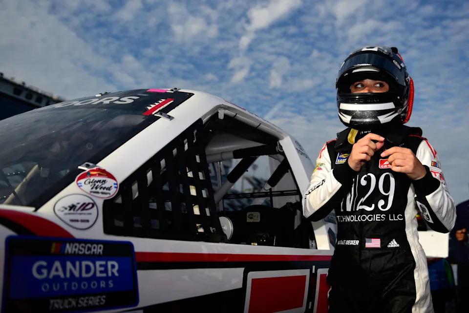 Natalie Decker, driver of the #54 N29 Technologies LLC Toyota, stands on the grid during qualifying for NASCAR Gander Outdoor Truck Series NextEra 250.