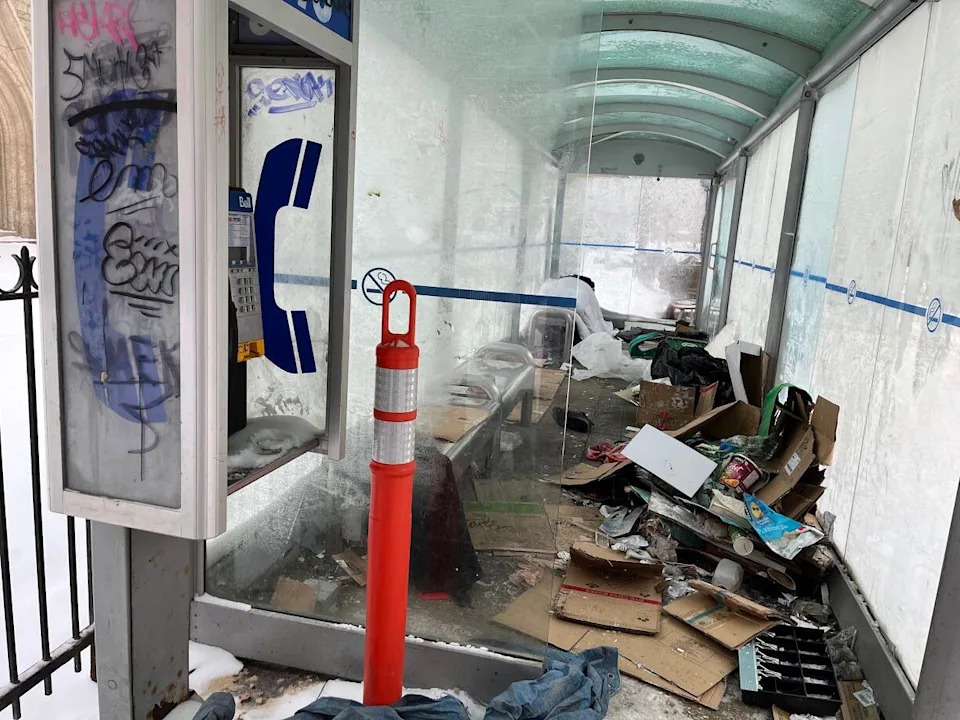 A bus shelter in downtown Winnipeg is seen in a file photo, filled with trash.
