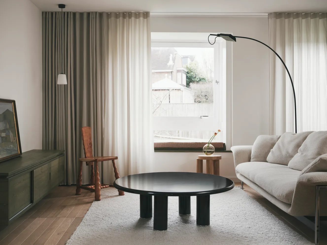A living room designed by Studio George and Cake Architecture with vintage, contemporary, and bespoke furniture.