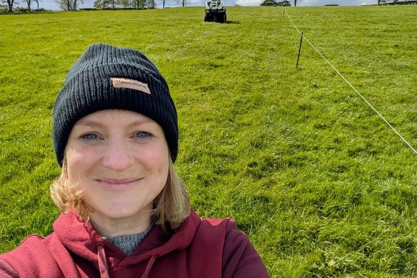 A woman in a hat smiling