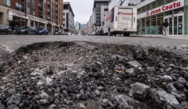 A pothole in the middle of the street.