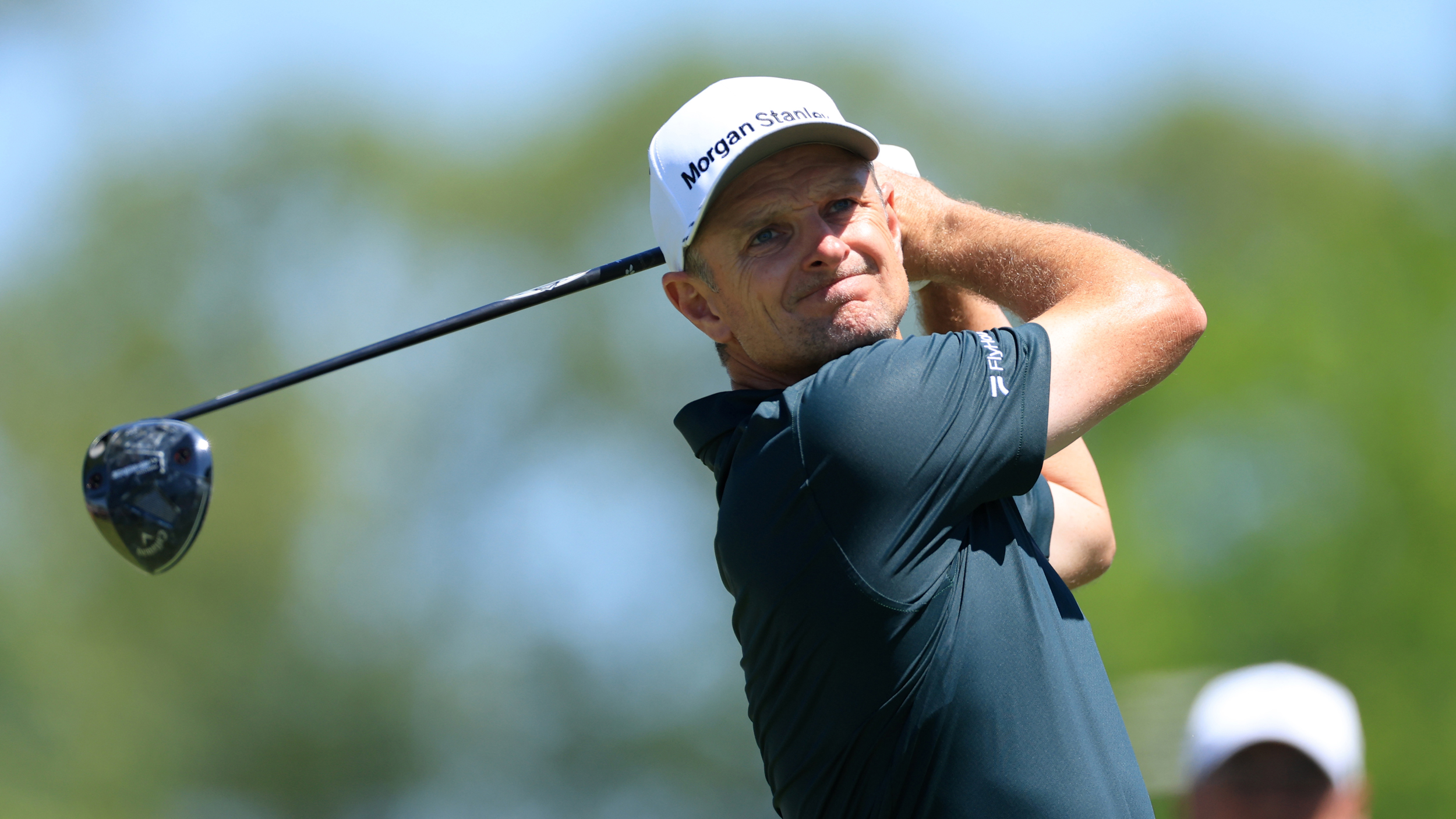 Justin Rose holds his finish on a drive