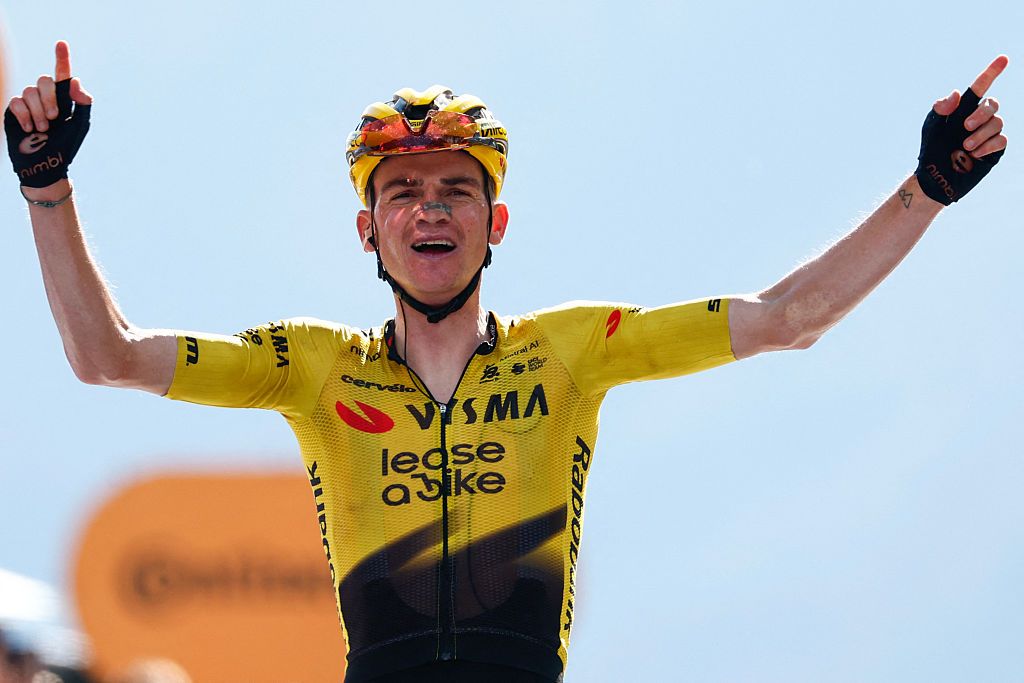 Team Visma Lease a Bike US rider Sepp Kuss celebrates as he crosses the finish line to win the 19th stage of the Giro d'Italia 2026