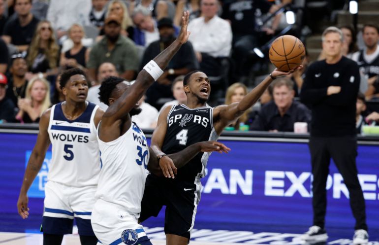 SAN ANTONIO, TX -MAY 12: De'Aaron Fox drives past Julius Randle #30 of the Minnesota Timberwolves in the first half of Game Five of the Western Conference Semifinals NBA Playoffs at Frost Bank Center on May 12, 2026 in San Antonio, Texas. NOTE TO USER: User expressly acknowledges and agrees that, by downloading and or using this photograph, User is consenting to terms and conditions of the Getty Images License Agreement. Ronald Cortes/Getty Images/AFP (Photo by Ronald Cortes / GETTY IMAGES NORTH AMERICA / Getty Images via AFP)