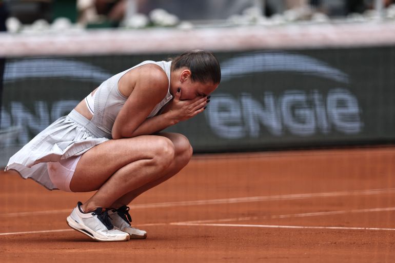 Ukraine's Marta Kostyuk celebrates after winning against Poland's Iga Swiatek at the end of their women's singles match on day 8 of the French Open tennis tournament on Court Philippe-Chatrier at the Roland-Garros Complex in Paris on May 31, 2026. (Photo by Anne-Christine POUJOULAT / AFP)