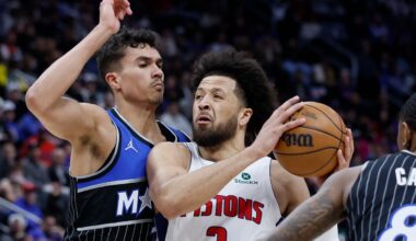 Detroit Pistons guard Cade Cunningham (2) goes to the basket between Orlando Magic forward Tristan da Silva (23) and forward Jamal Cain (8) during the first half in Game 5 of a first-round NBA basketball playoffs series Wednesday, April 29, 2026, in Detroit. (AP Photo/Duane Burleson)