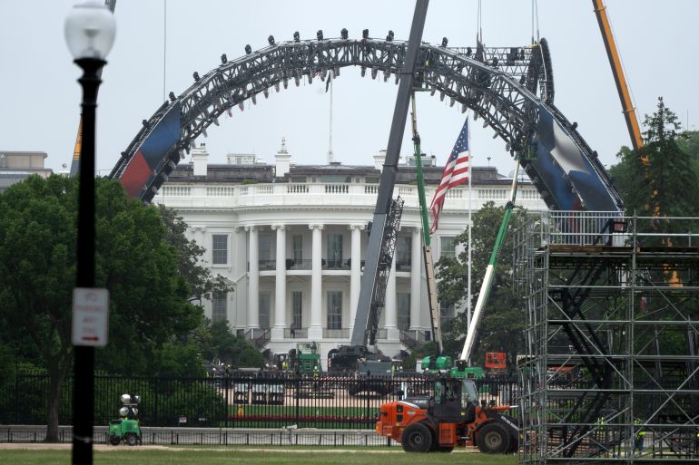 Equipment being placed on the South Lawn of the White House is seen from the Washington Monument, Tuesday, May 26, 2026, in Washington. The UFC is holding a mixed martial arts fight on June 14 as part of America 250 celebrations.