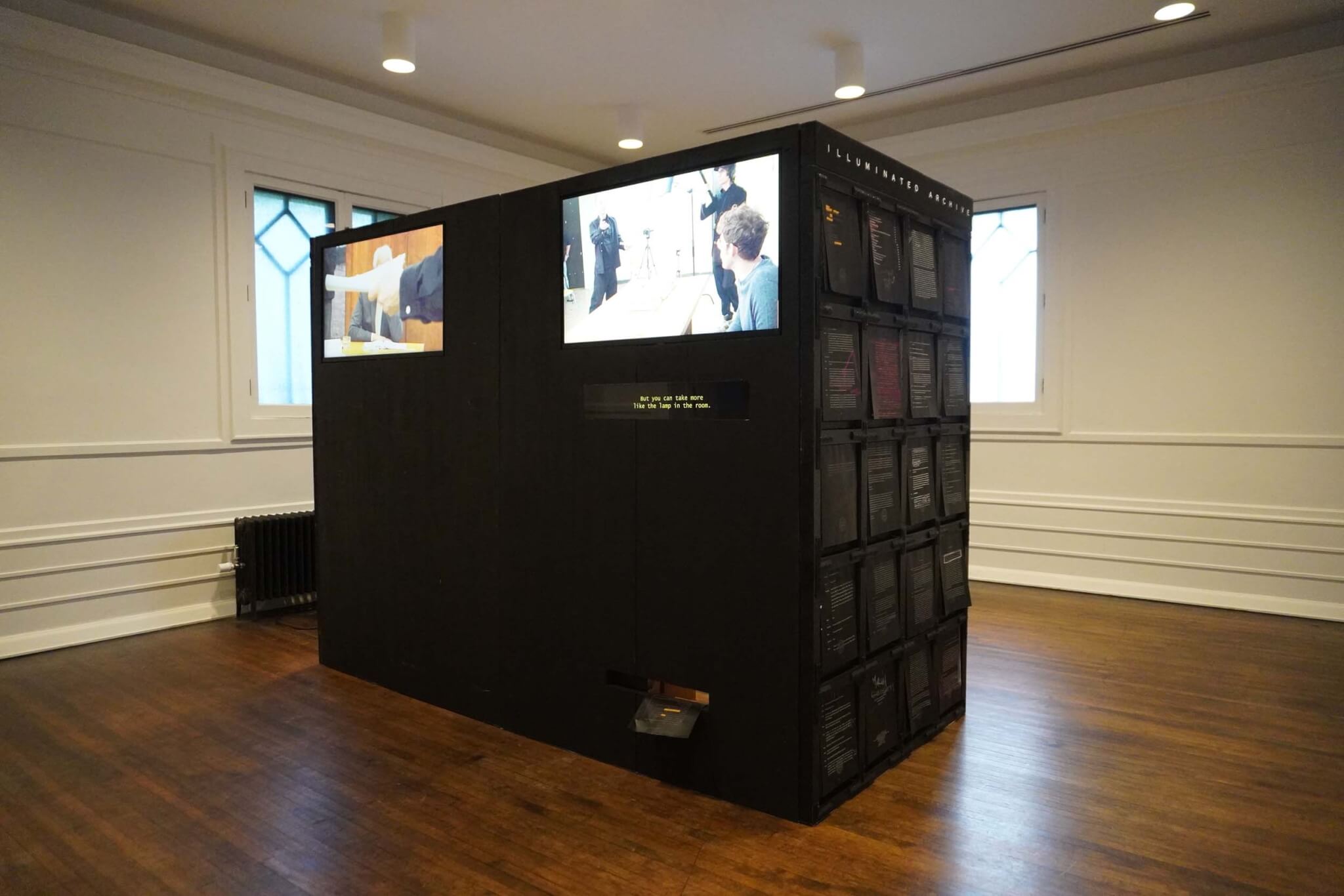 Large black cabinet in a gallery