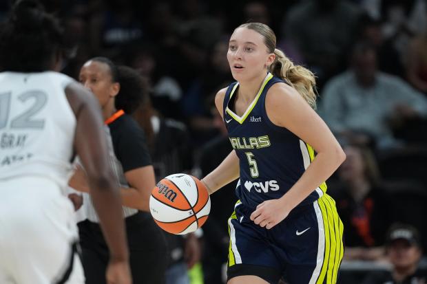 Dallas Wings guard Paige Bueckers (5) moves the ball up court against the Las Vegas Aces during the second half of a WNBA preseason basketball game in Austin, Texas, Sunday, May 3, 2026. (AP Photo/Eric Gay)