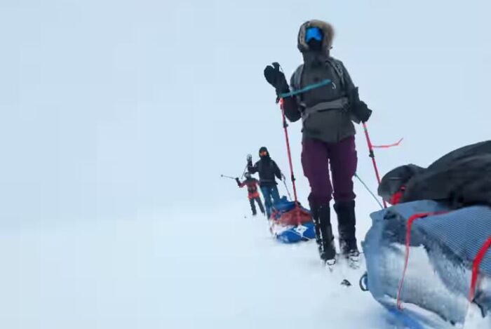 A team of adventurers skiing on the Greenland ice sheet