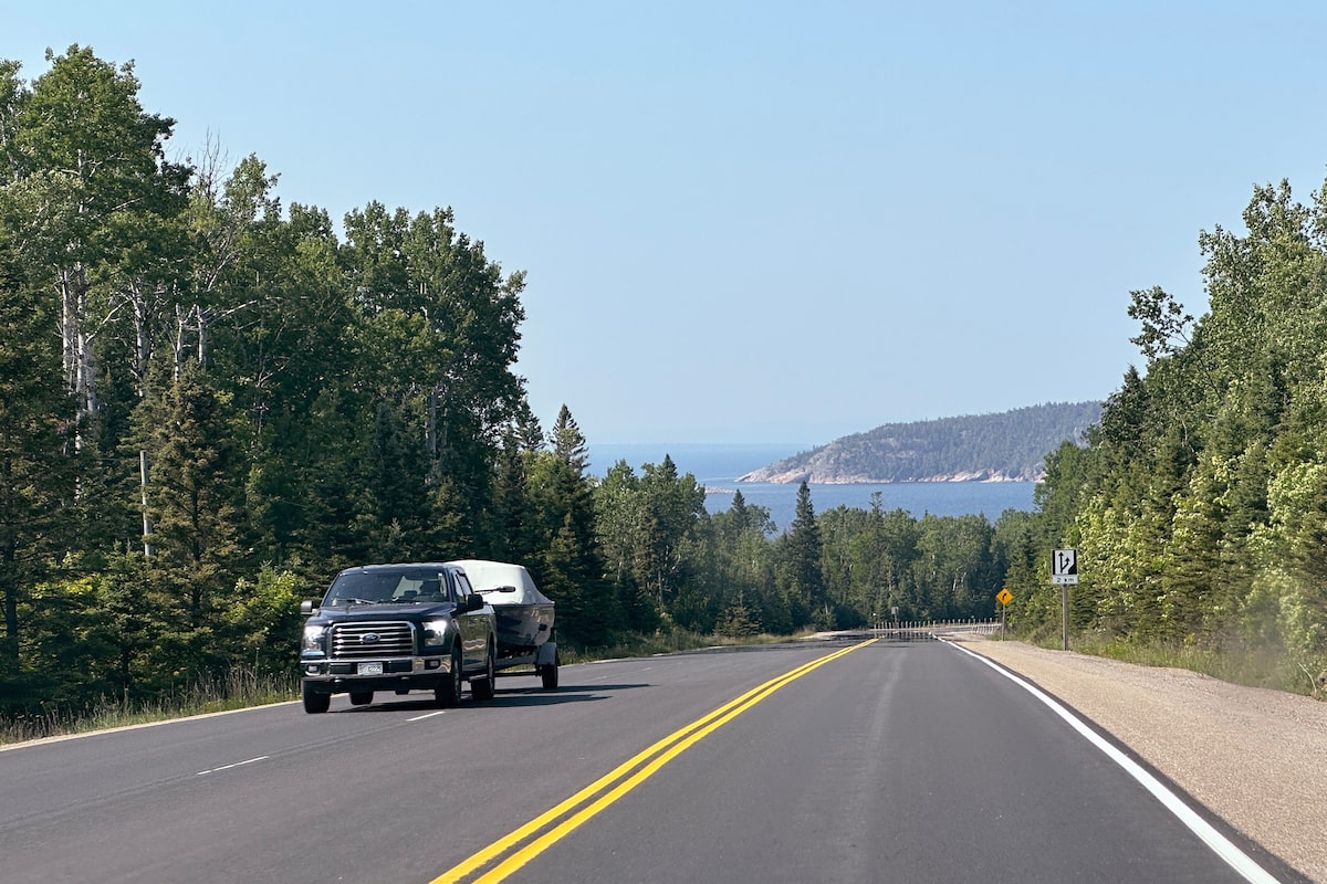Is it legal to cross a yellow solid double line in Ontario?