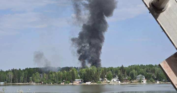 Fire west of Barrhead sets buildings on fire, residents ordered to evacuate - Edmonton