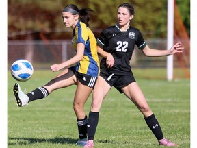Pain Court's Jaedyn Payne (5) kicks the ball away from Lajeunesse's Jennifer Hawkins (22) in the SWOSSAA senior girls A soccer final at Ecole Secondaire de Pain Court in Pain Court, Ont., on Thursday, May 28, 2026. Mark Malone/Chatham Daily News/Postmedia Network