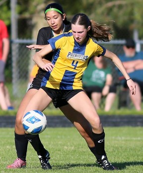 Pain Court's Bailey Williams (4) battles Lajeunesse's Mila Dacruz (8) in the SWOSSAA senior girls A soccer final at Ecole Secondaire de Pain Court in Pain Court, Ont., on Thursday, May 28, 2026. Mark Malone/Chatham Daily News/Postmedia Network