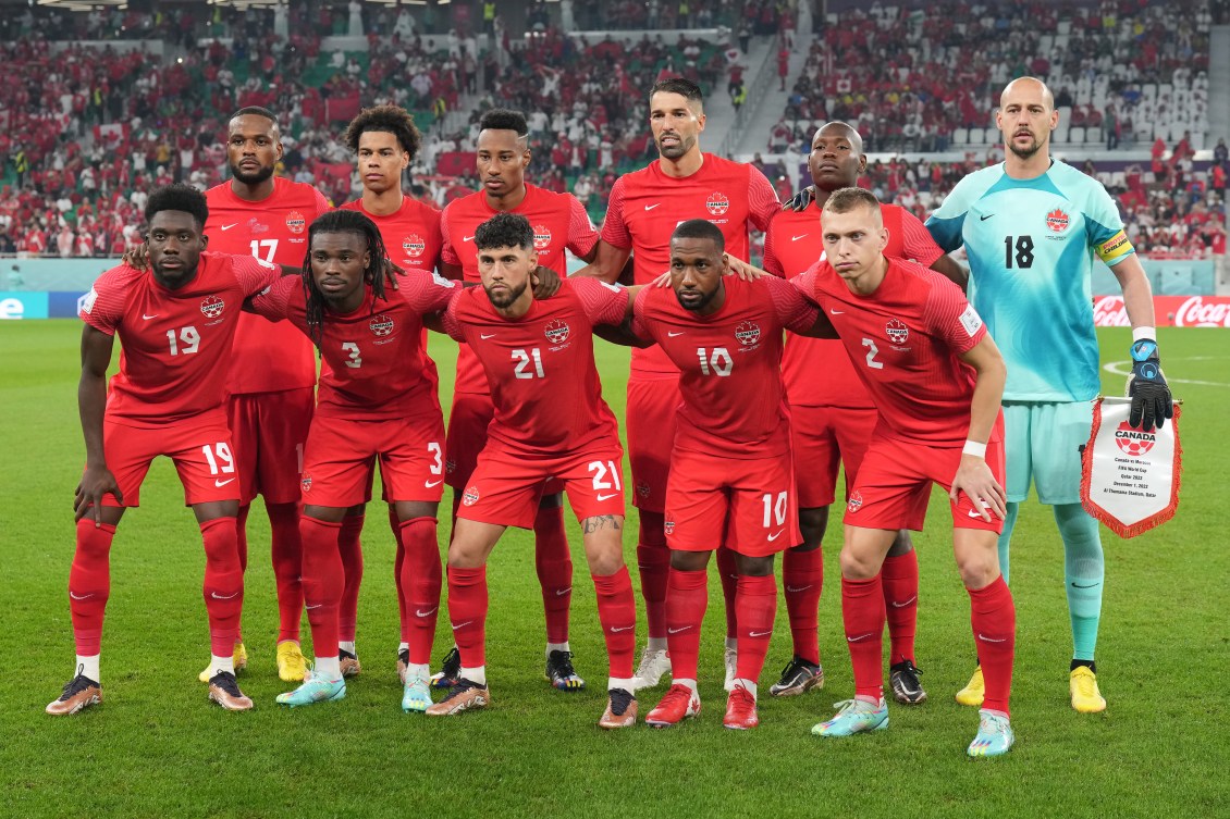 Canada players pose before a game against Morocco at the 2022 FIFA World Cup