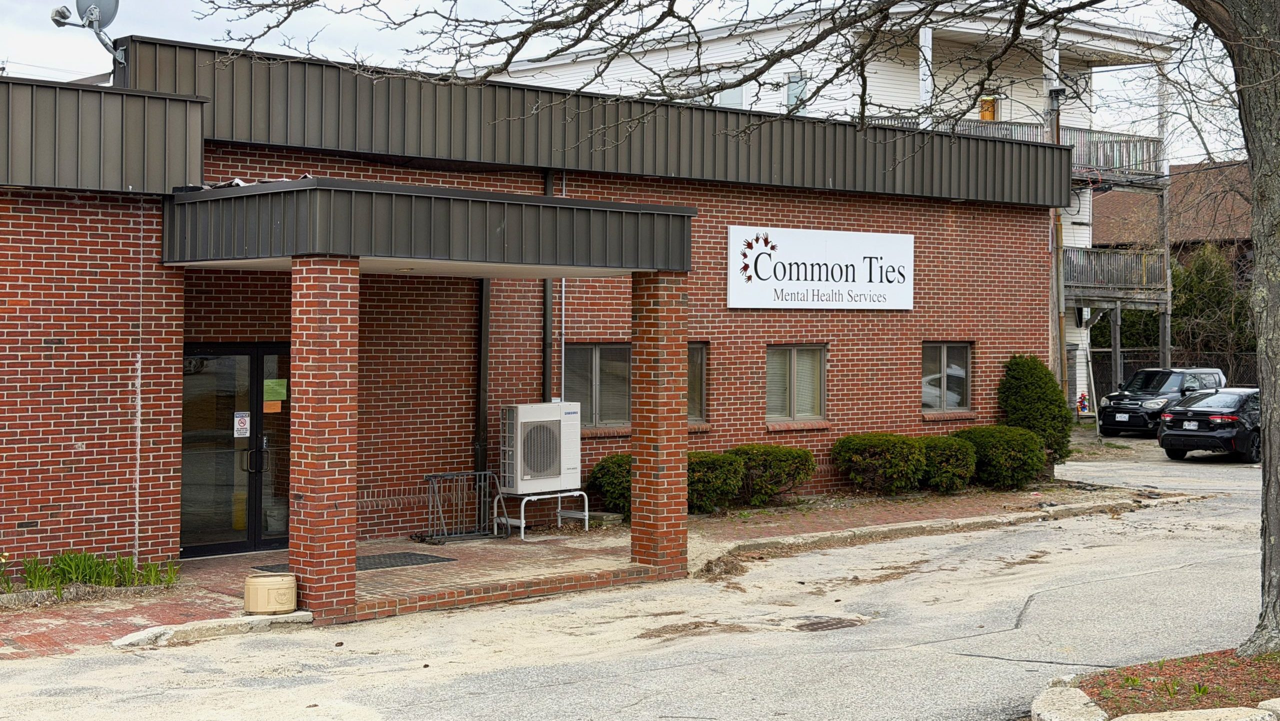 Entryway to a small brick building.