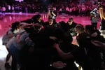 Portland Fire players huddle before a WNBA preseason basketball game against the Los Angeles Sparks, Sunday, May 3, 2026, in Portland, Ore.