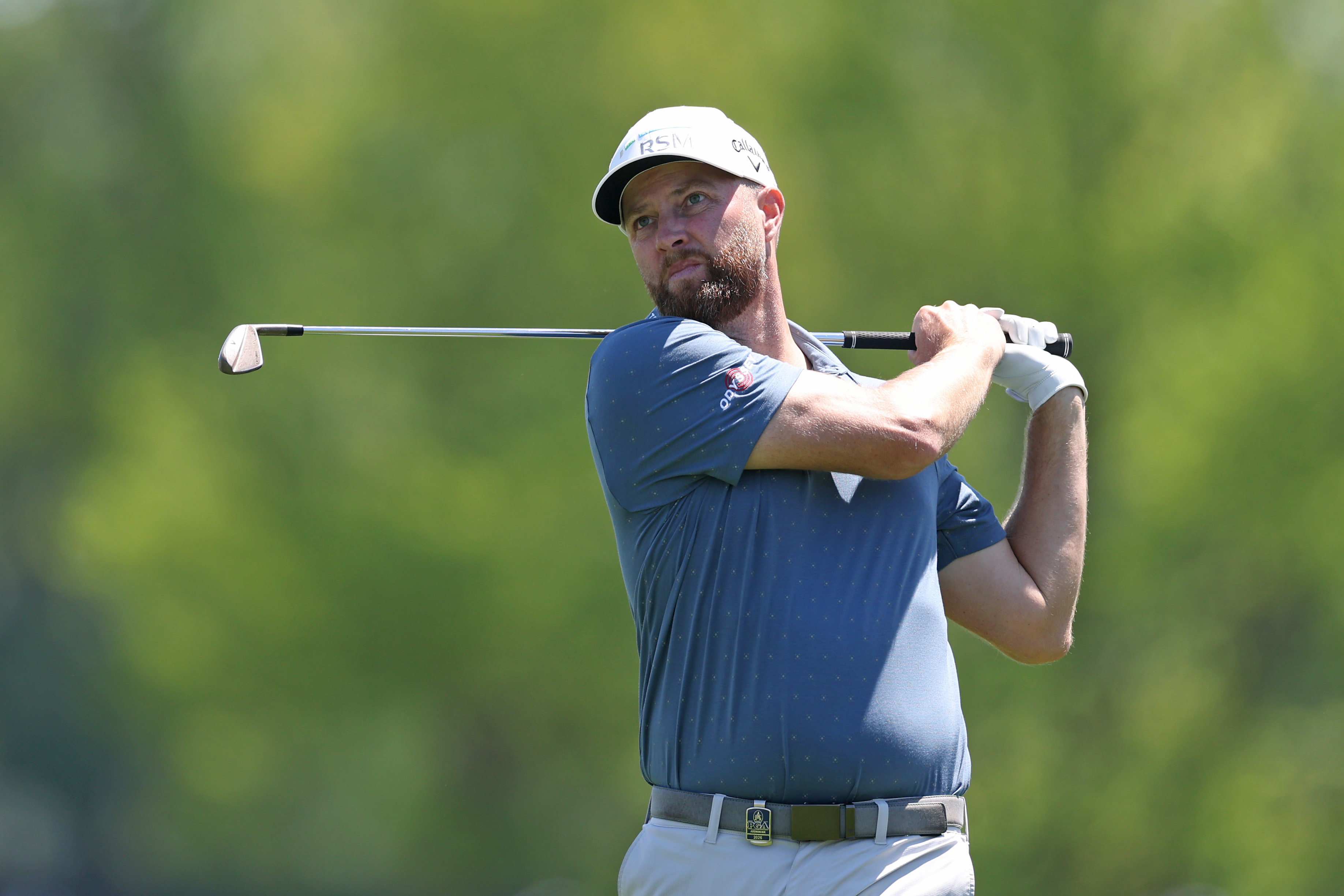 Chris Kirk holds his finish on an iron shot at the PGA Championship