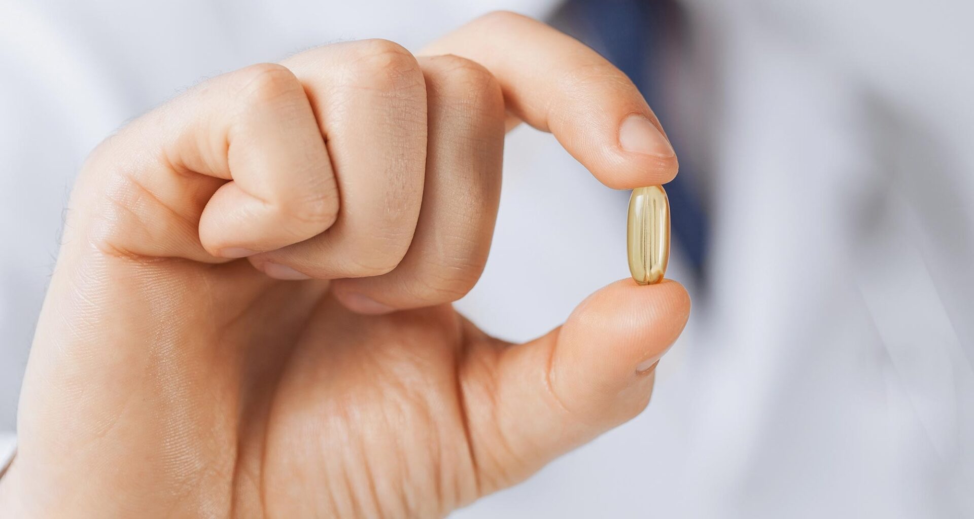 Doctor Holding Vitamin Supplement Medicine Capsule