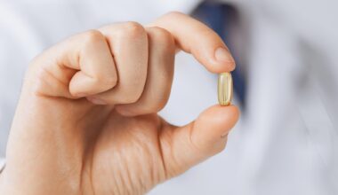 Doctor Holding Vitamin Supplement Medicine Capsule