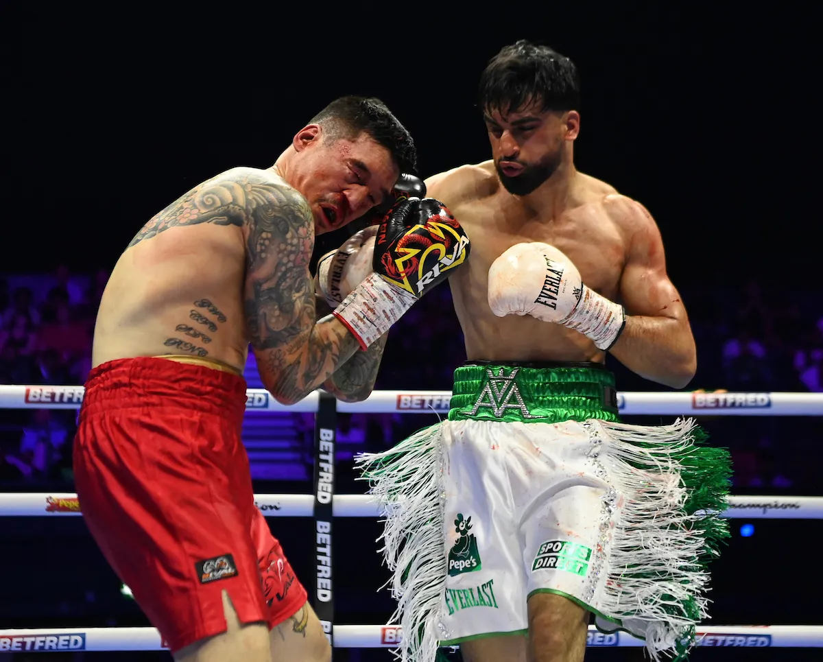 Adam Azim lands one of many hard right hands on Steve Claggett