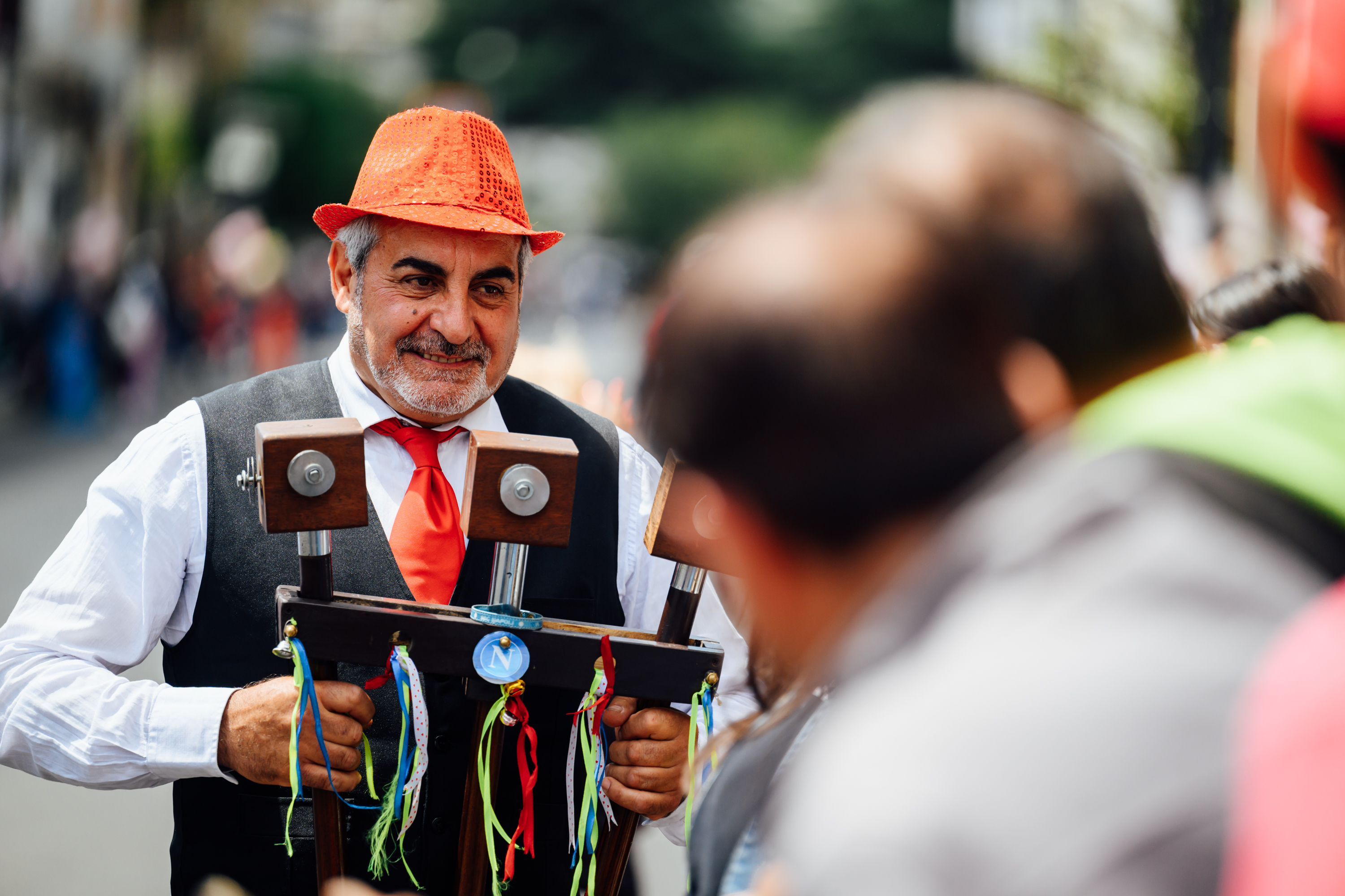 Fans, crowds, spectators and a man plays a scetavajasse at the start of stage 7. Images from 2026 Giro d'Italia stage 7 to Blockhaus